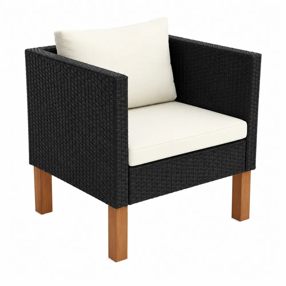 Poltrona in rattan sintetico con gambe in legno e cusci